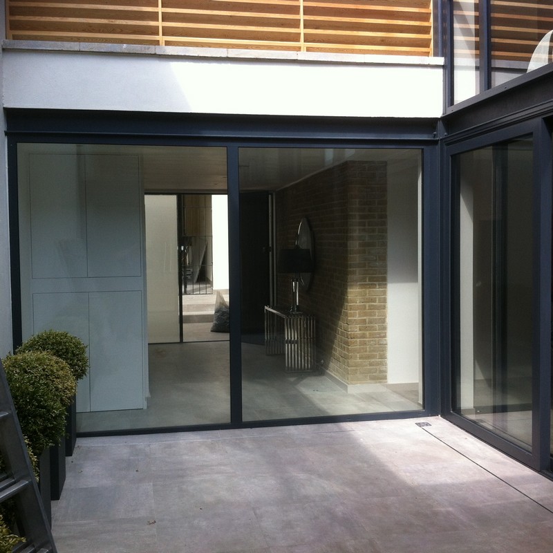 Floor-to-ceiling sliding doors opening to courtyard in Bloomsbury