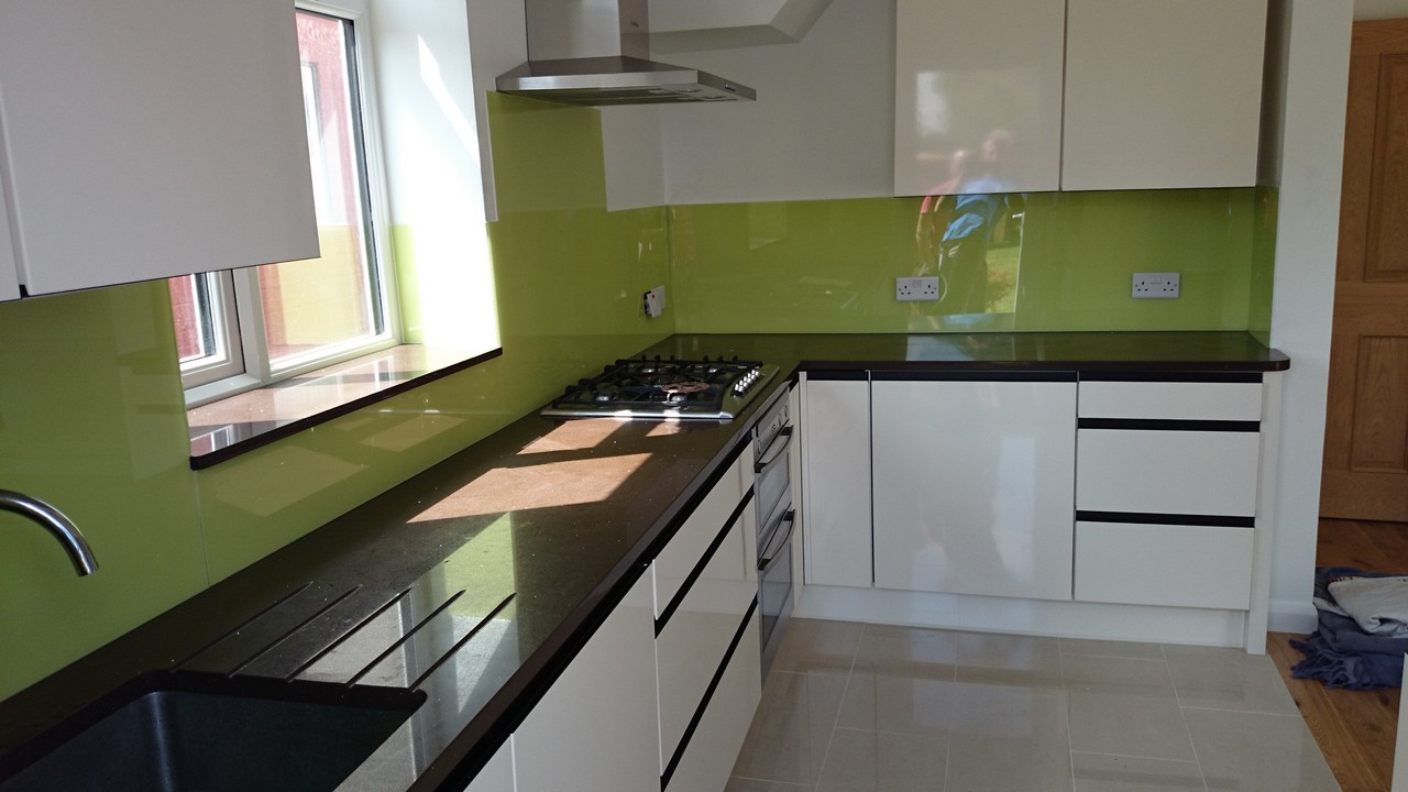 Lime green glass kitchen splashback installed by Bloomsbury glaziers
