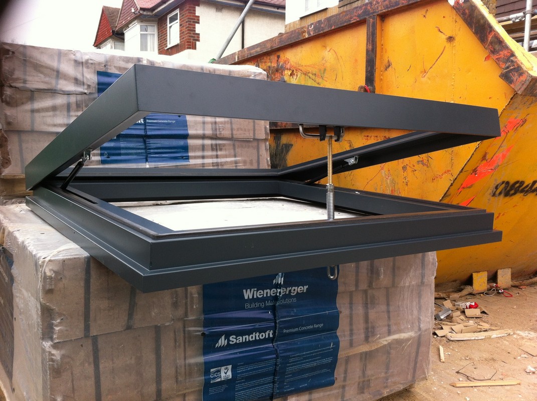 Opening flat roof skylight in anthracite grey installed in Bloomsbury